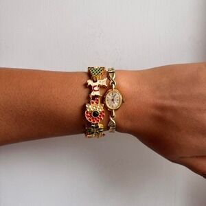 GOLD TONE CHRISTMAS THEMED CHARM BRACELET
